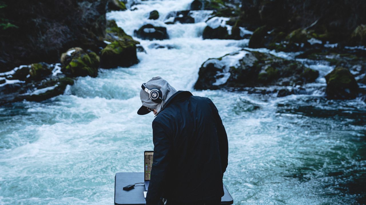 Wallpaper man, dj, headphones, river, stones, music