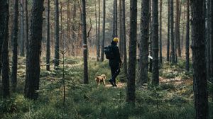 Preview wallpaper man, dog, forest, walk, trees, nature