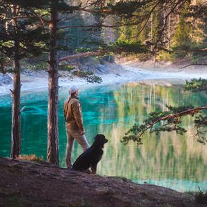Preview wallpaper man, dog, lake, nature, walk