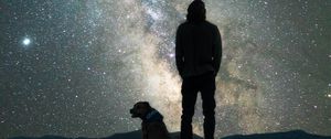 Preview wallpaper man, dog, night, starry sky, nebula