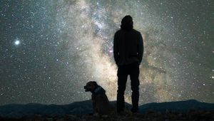 Preview wallpaper man, dog, night, starry sky, nebula