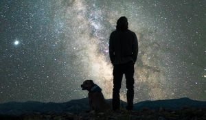 Preview wallpaper man, dog, night, starry sky, nebula