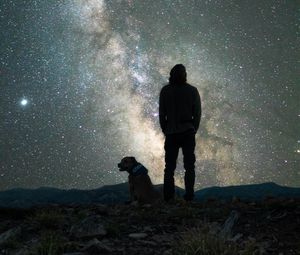 Preview wallpaper man, dog, night, starry sky, nebula