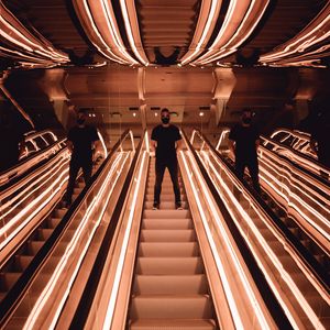 Preview wallpaper man, escalator, reflection, mirror, backlight