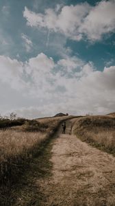 Preview wallpaper man, field, path, sky, clouds