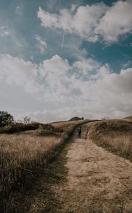Preview wallpaper man, field, path, sky, clouds