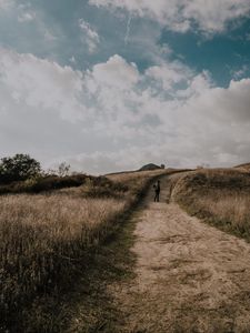 Preview wallpaper man, field, path, sky, clouds