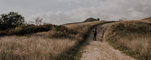 Preview wallpaper man, field, path, sky, clouds