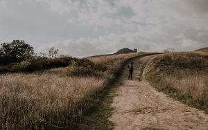 Preview wallpaper man, field, path, sky, clouds