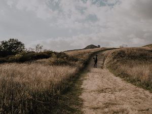 Preview wallpaper man, field, path, sky, clouds