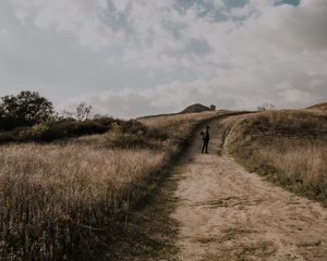 Preview wallpaper man, field, path, sky, clouds
