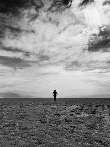 Preview wallpaper man, field, sky, bw