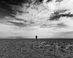 Preview wallpaper man, field, sky, bw