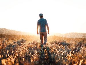 Preview wallpaper man, field, sunlight, light, bright