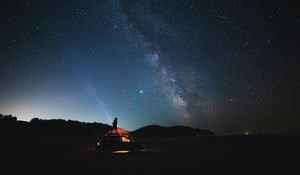 Preview wallpaper man, flashlight, car, night, starry sky