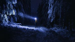Preview wallpaper man, flashlight, night, forest, snow, dark