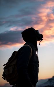 Preview wallpaper man, gas mask, sunset, sky