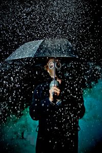 Preview wallpaper man, gas mask, umbrella, rain, mood