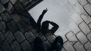 Preview wallpaper man, gesture, puddle, legs, silhouette