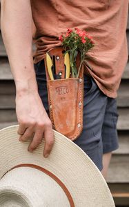 Preview wallpaper man, hand, flowers, hat