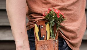 Preview wallpaper man, hand, flowers, hat