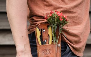 Preview wallpaper man, hand, flowers, hat