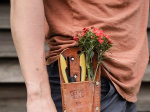 Preview wallpaper man, hand, flowers, hat