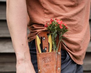 Preview wallpaper man, hand, flowers, hat