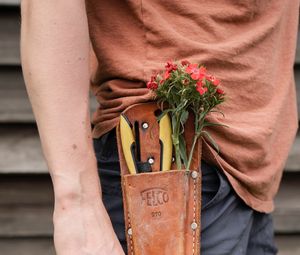 Preview wallpaper man, hand, flowers, hat