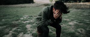 Preview wallpaper man, hands, face, sad