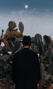 Preview wallpaper man, hat, cactus, alone, moon