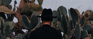 Preview wallpaper man, hat, cactus, alone, moon