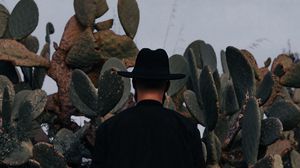 Preview wallpaper man, hat, cactus, alone, moon