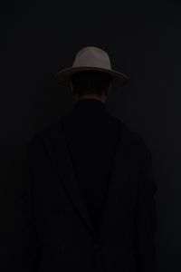 Preview wallpaper man, hat, dark