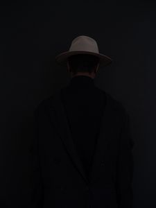Preview wallpaper man, hat, dark