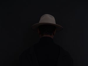 Preview wallpaper man, hat, dark
