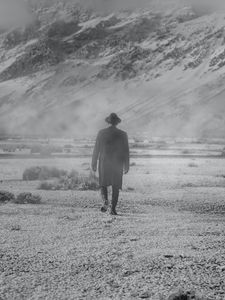 Preview wallpaper man, hat, mountains, snow, black and white, bw