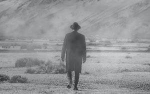 Preview wallpaper man, hat, mountains, snow, black and white, bw