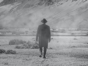 Preview wallpaper man, hat, mountains, snow, black and white, bw