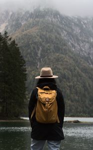 Preview wallpaper man, hat, river, trees, mountain, travels