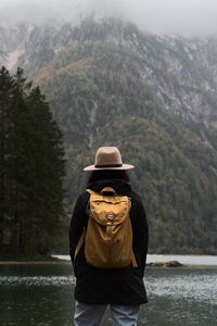 Preview wallpaper man, hat, river, trees, mountain, travels