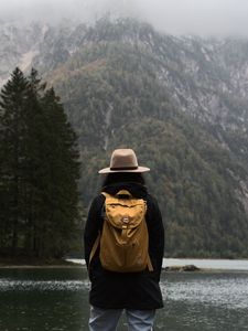 Preview wallpaper man, hat, river, trees, mountain, travels