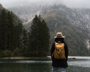 Preview wallpaper man, hat, river, trees, mountain, travels