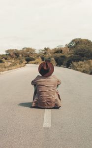 Preview wallpaper man, hat, road, asphalt, loneliness