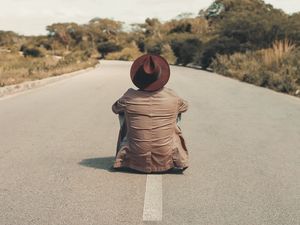 Preview wallpaper man, hat, road, asphalt, loneliness