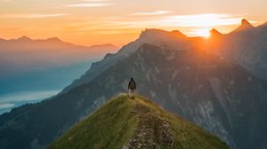 Preview wallpaper man, hill, sunset, sky