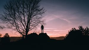 Preview wallpaper man, hill, trees, evening