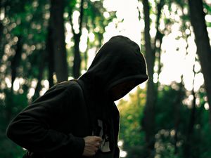 Preview wallpaper man, hood, anonymous, forest