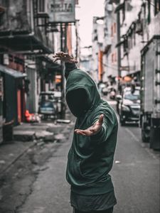 Preview wallpaper man, hood, anonymous, hands, gesture