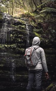 Preview wallpaper man, hood, backpack, waterfall